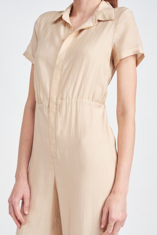 This stylish jumpsuit is the perfect blend of sophistication and practicality. Crafted with breathable, lightweight fabric, the short sleeves, open back, and fitted silhouette make it comfortable and airy, ideal for warm-weather wear. With a flattering design and a chic, timeless look, it's sure to be a wardrobe staple. SIZE S M L MADE IN IMPORTED FABRIC 60% LYOCELL, 40% POLYESTER LINING: 100% RAYON SIZE & FIT : MODEL WEARS SIZE SMALL MODEL'S HEIGHT 5'9 Emory Park is a Young Contemporary clothin Summer Short Sleeve Relaxed Fit Jumpsuits And Rompers, Summer Daywear Short Sleeve Jumpsuits And Rompers, Summer Jumpsuits And Rompers With Short Sleeves Relaxed Fit, Summer Daywear Jumpsuits And Rompers With Short Sleeves, Summer Short Sleeve Jumpsuits And Rompers For Daywear, Solid Color Short Sleeve Relaxed Fit Jumpsuits And Rompers, Relaxed Fit Solid Jumpsuits And Rompers With Short Sleeves, Relaxed Fit Short Sleeve Jumpsuits And Rompers, Summer Fitted Jumpsuits And Rompers With Short Sleeve