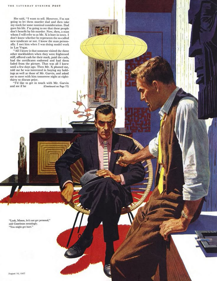 two men are sitting in chairs and one is looking at another man's tie