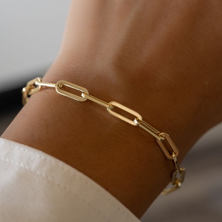 This paperclip bracelet is beautifully made. The minimalist design makes it a great layering piece, but also looks great on its own! We use a THICK plating of 14k Gold or Rhodium over 925 Sterling Silver Available in 6.25" or 6.75" + .5" Extension Chain Lobster Clasp Closure Nickel-free & Hypoallergenic Luxury Everyday Paperclip Bracelet With Rectangular Shape, Luxury Timeless Gold Paperclip Bracelet, Luxury Timeless Paperclip Chain Bracelet, Luxury Classic Paperclip Bracelet With Rectangular Links, Luxury Gold Minimalist Paperclip Bracelet, Luxury Paperclip Chain Link Bracelet For Everyday, Luxury Timeless Paperclip Bracelet With Solid Links, Luxury Minimalist Gold Paperclip Bracelet, Luxury Classic Paperclip Chain Link Bracelet