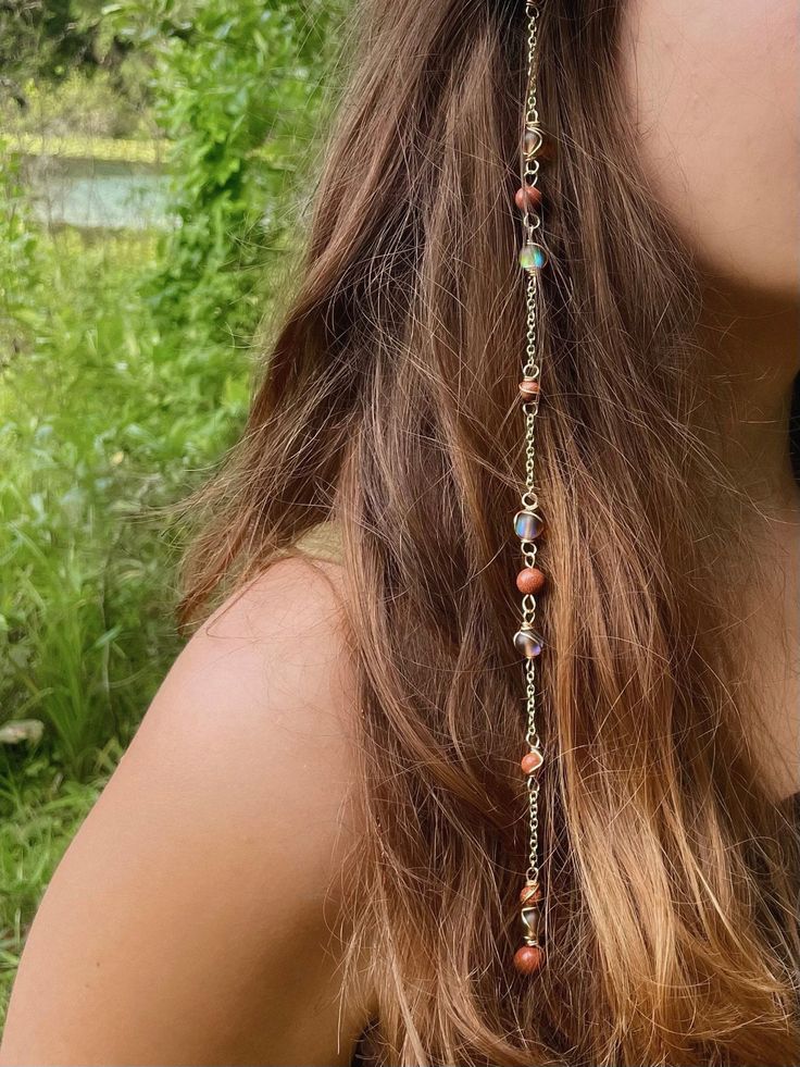 Mars Goddess Hippie Hair Bead: Set with the intention of providing protection and grounding. Perfect for protection during mercury retrograde! Includes a Sensitive Scalp Attachment Clip to attach the Hippie Hair Bead to your hair! Crystals: Glass Shiny Brown Beads and Gold Stone. 🫧Every order comes with a goodie bag full of an assortment of hippie items!🫧 Hippie Hair Beads are made using Sterling Silver Wire/Gold Plated Wire each piece is made with ethnically sourced crystals<3 Each are handma Boho Hair Jewelry, Crystals On Hair, Hippie Hair Jewelry, Hair Crystal Accessories, Cottage Core Hair Accessories, Wire Wrapped Hair Accessories, Hair With Charms, Diy Beaded Hair Accessories, Fairy Hippie Outfits