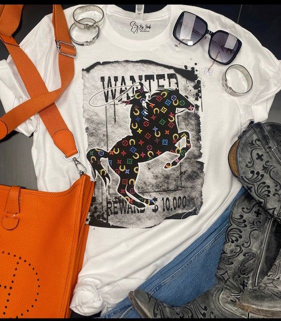 Show off this colorful LV inspired cowboy Wanted Reward Tee! Perfect for a night out or casual patio day! This is a PreOrder item so reserve your size Small - 3XL and fits true to size. Casual Summer T-shirt For Ranch, Casual Summer Outdoor T-shirt, Trendy White Tops For Ranch, Multicolor Cotton Tops For Rodeo, Black T-shirt For Summer Rodeo, Black T-shirt For Rodeo In Summer, Lv Inspired, Denim Suspenders, Printed Flare Pants