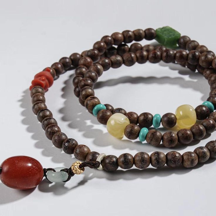 Four  Circles Buddha Beads Traditional Brown Beaded Bracelets With Natural Stones, Traditional Brown Beaded Bracelet With Natural Stones, Amber Carnelian Round Beaded Bracelets, Brown Jade Jewelry For Healing, Meditation Brown Bracelet With Polished Beads, Brown Jade Round Bead Jewelry, Brown Jade Round Beads Jewelry, Brown Natural Stones Bracelet For Meditation, Brown Natural Stone Bracelet For Meditation