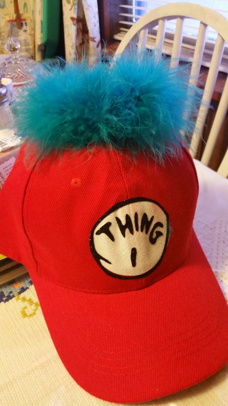 a red hat with blue fur on it sitting on top of a dining room table