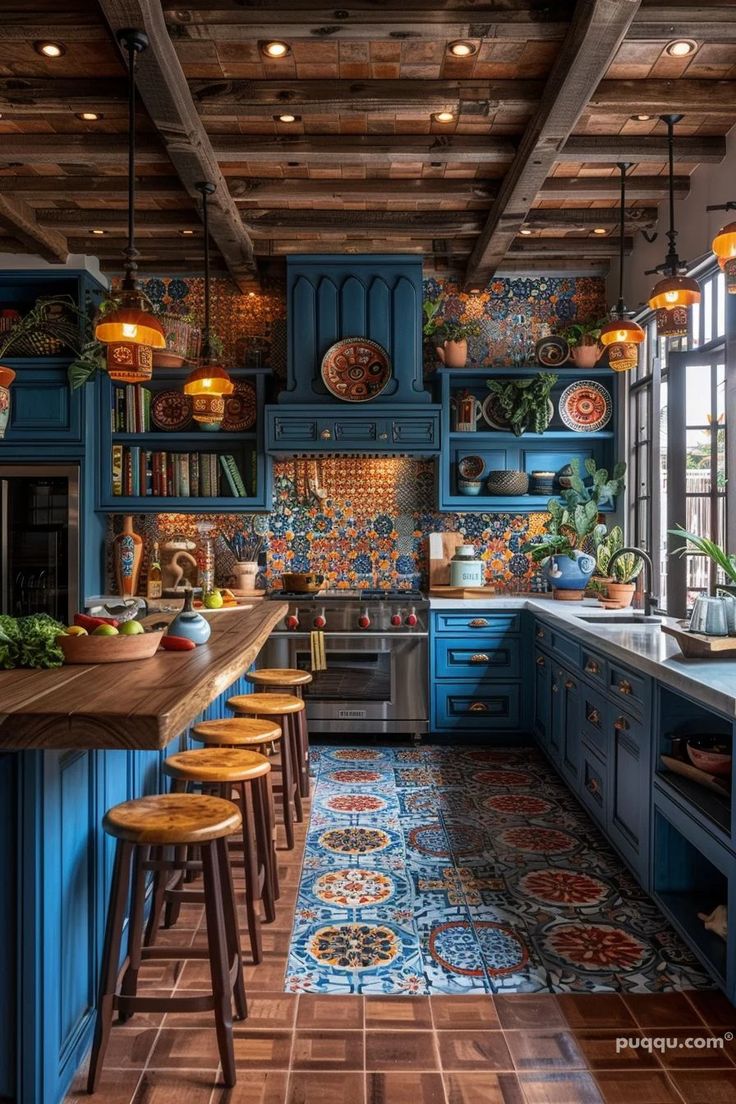 a kitchen with blue cabinets and wooden floors is pictured in this image, there are several stools at the counter