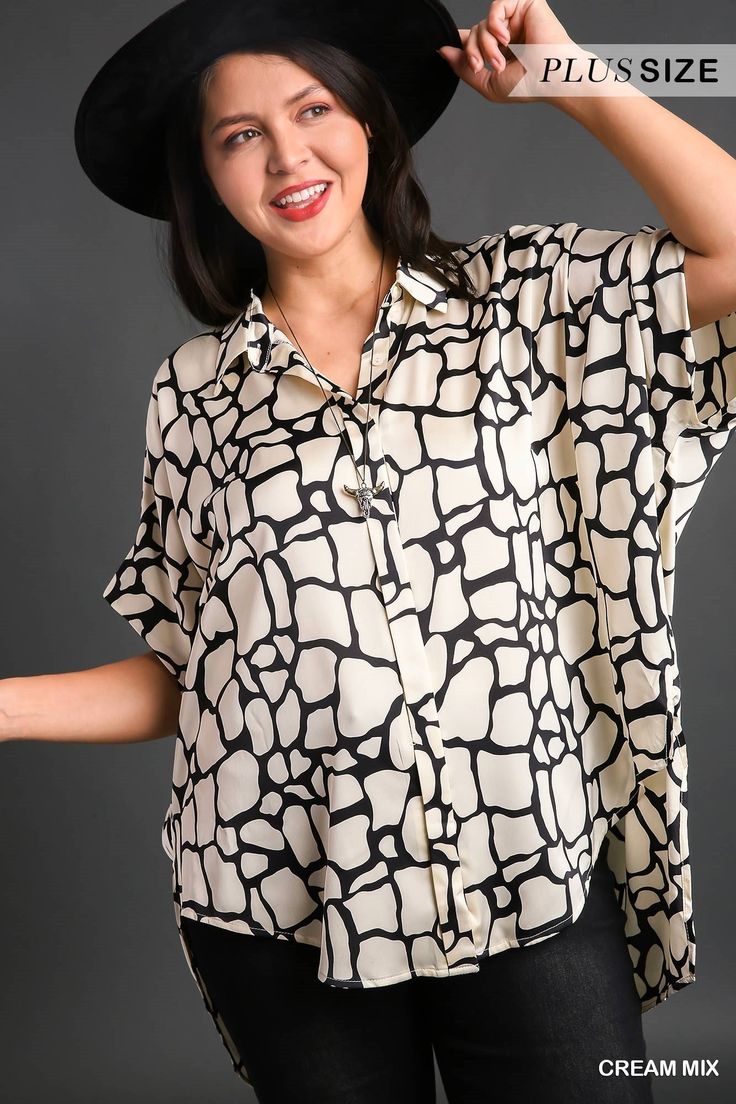 Introducing our Valley Vista Collared Button Down Top, a chic and versatile addition to your wardrobe. This stylish top features a playful print with short sleeves and a classic button-down design, perfect for effortless styling. With side slits and a high-low hem adding a modern twist, it's ideal for creating stylish yet relaxed looks. Crafted from 100% polyester fabric, the "Valley Vista" top ensures both comfort and durability for all-day wear. Whether you're running errands or meeting friend Chic Button-up Shirt With Graphic Print, Black Printed Button-up Top, Chic Button-up Blouse With Graphic Print, Chic Collared Blouse With Graphic Print, Chic Graphic Print Button-up Blouse, Casual Collared Blouse With Abstract Print, Trendy Button-up Blouse With Abstract Print, Trendy Black Top With Collared Neckline, Trendy Black Tops With Abstract Print