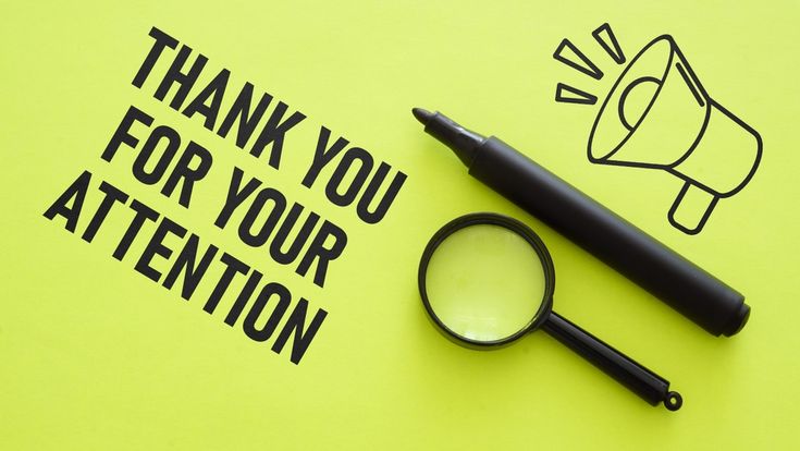 a thank you for your attention card with a magnifying glass, pen and marker