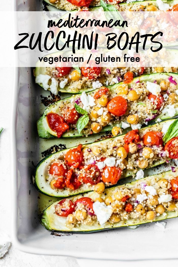 zucchini boats with tomatoes, chickpeas and feta cheese in a casserole dish