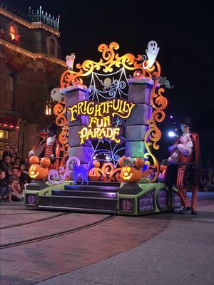 a parade float decorated with pumpkins and decorations