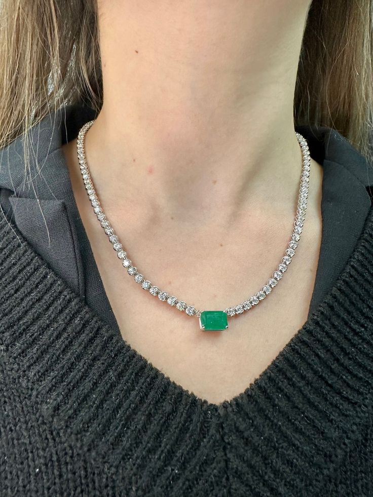 This very requested and popular tennis necklace is an absolute beauty. Elevate the look of a classic Tennis Necklace with a beautiful Emerald center Stone for a more unique piece. You will definitely not want to take off this gorgeous piece, it can be dressed up or down depending on how you wear .  Material: Solid 14K White Gold Diamonds: Round Cut, Prong Setting  *These are 100% Natural Earth Mined Diamonds. Carat: Approximately 2.50Ct Emerald Center Stone- 8.50Ct Round Diamond Side stones  Col Elegant Round Gemstone Tennis Necklace, Elegant Gemstone Tennis Necklace, Formal White Gold Tennis Necklace With Gemstone, Formal Gemstone Tennis Necklace, Luxury Round Gemstone Tennis Necklace, Luxury Gemstone Tennis Necklace, Fine Jewelry Tennis Necklace With 17 Jewels For Anniversary, Luxury Gemstone Tennis Necklace As Gift, Luxury Single Strand Tennis Necklace For Anniversary