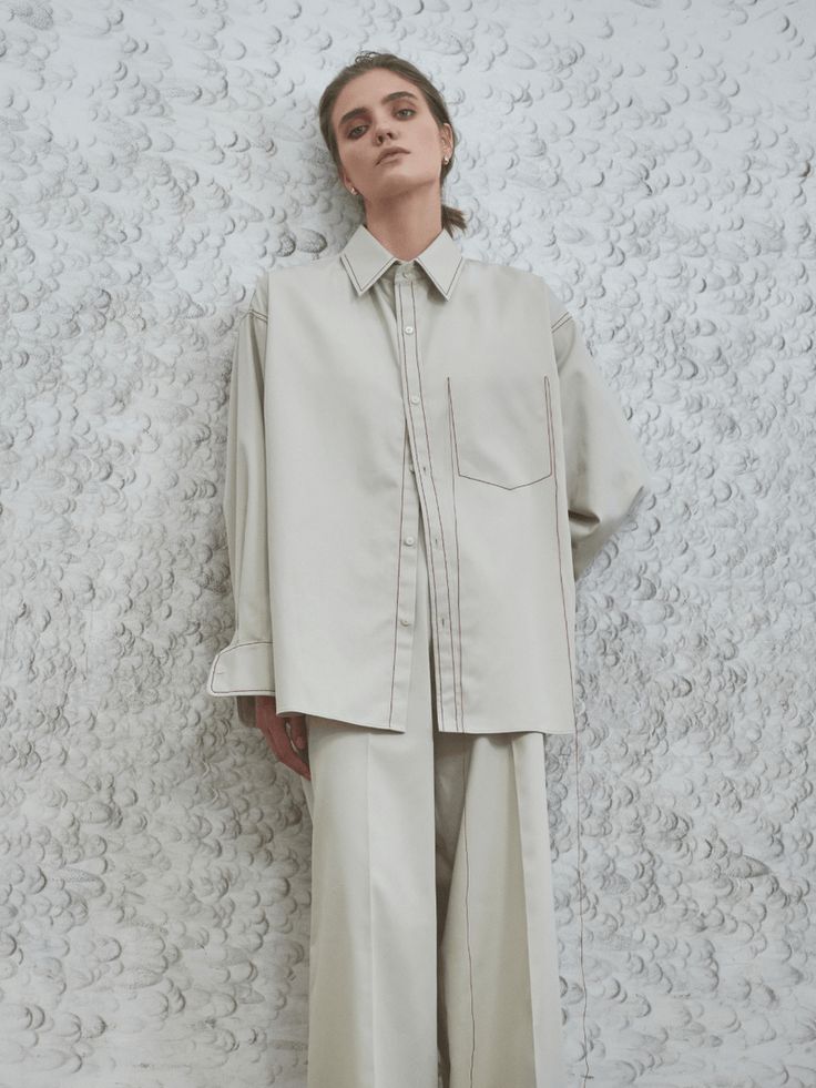 Embrace refined comfort with our Frankie Oversized Shirt, an essential for those who like to be at the vanguard of modernity. Tailored for an oversized fit, this shirt showcases topstitching details and a mid-weight fabric that perfectly blend style and functionality. Secured at the front with multiple buttons, it refl Modern Oversized Collared Blouse, Modern Boxy Fit Tops For Workwear, Modern Oversized Shirt With Pockets, Oversized Workwear Shirt With Concealed Placket, Relaxed Fit Tops With Contrast Stitching For Spring, Oversized Tops For Workwear With Straight Hem, Oversized Straight Hem Tops For Work, Oversized Tops With Straight Hem For Work, Spring Tops With Contrast Stitching And Relaxed Fit