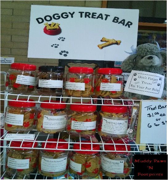 dogy treat bar displayed in store with teddy bear and other items on display for sale