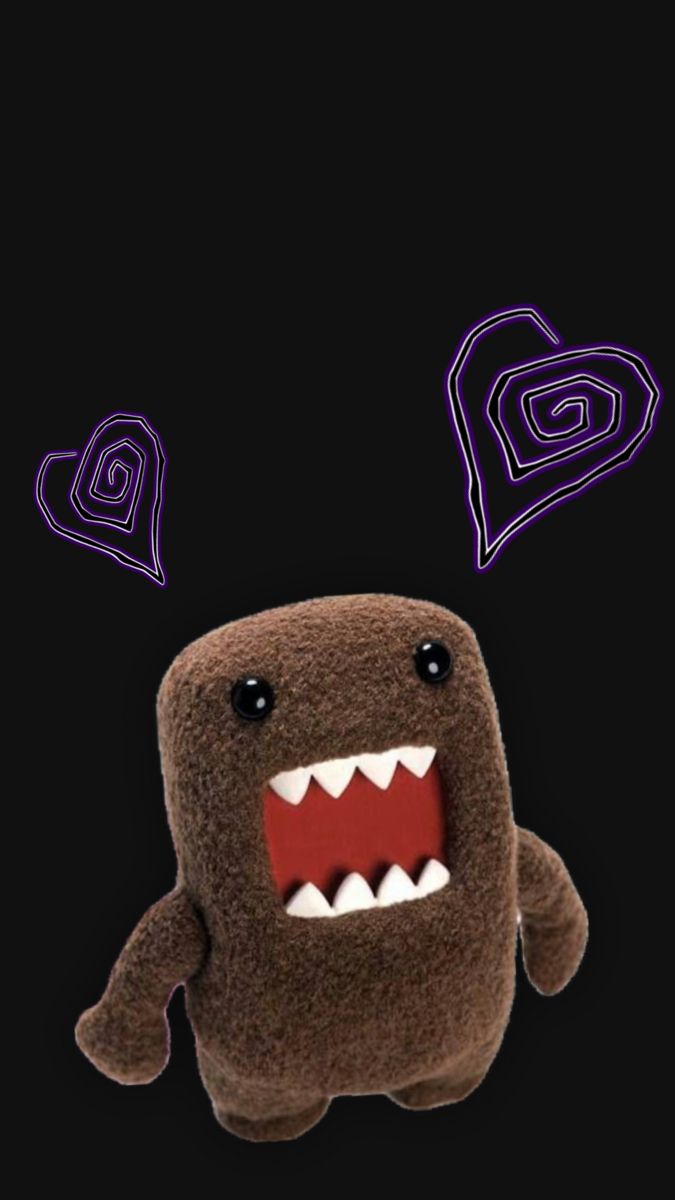 a stuffed animal with its mouth open and teeth wide open, on a black background