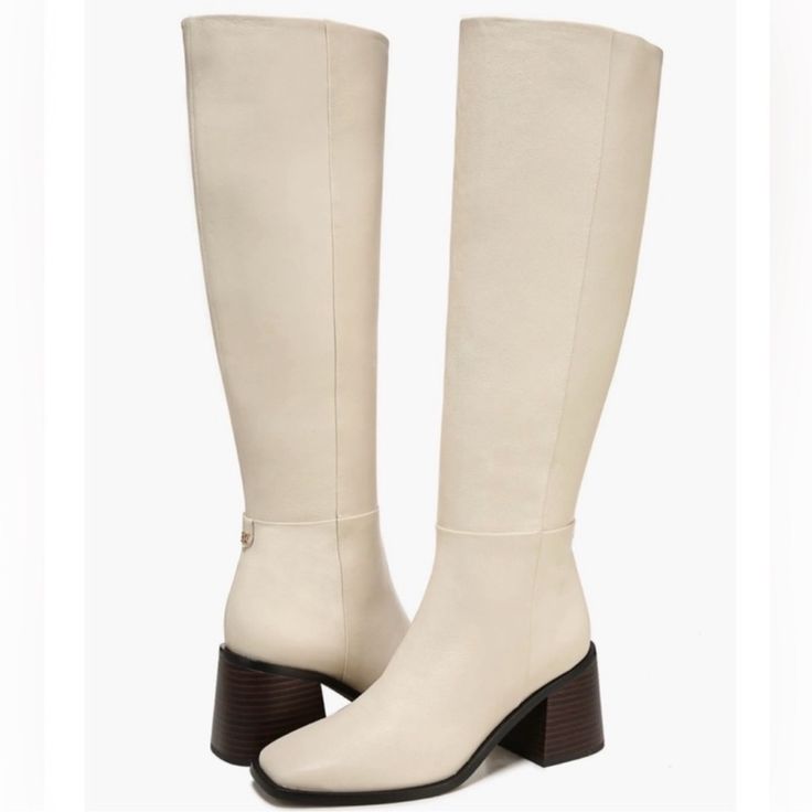 A Flared Block Heel And Blunt Square Toe Add A Hint Of Signature Style To An Essential Knee-High Boot Shaped From Smooth Leather. Sam Edelman "Wade" Square Toe Boots New. Size 6.5 Ivory Leather The Most Perfect Winter White Knee High Smooth Leather Upper Blunt Square Toe Retro Style Partial Inside Zipper Closure Flared Block Heel Leather & Synthetic Material 2.75" Heel Height 16.25" Shaft Height 15.75" Opening Circumference These Are New However Were Stored With A Large Pallet Of Shoes And There Beige Leather Knee-high Boots With Pointed Toe, Cream Boots With Leather Sole And Round Toe, Elegant Beige Knee-high Boots For Work, Beige Boots With Stacked Block Heel, Chic Beige Wide Calf Knee-high Boots, Beige Knee-high Heeled Boots For Formal Occasions, Beige Knee-high Heeled Boots For Formal Events, Chic Beige Knee-high Workwear Boots, Chic Beige Knee-high Boots For Work