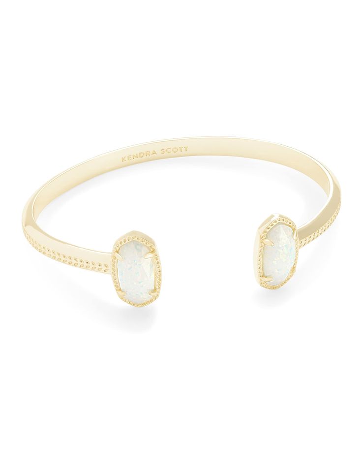 PRICES MAY VARY. A dainty pinch cuff bookended with our signature oval stones, the Elton Gold Cuff Bracelet in White Kyocera Opal is a stack staple. Gift Box & Jewelry Bag: Your Kendra Scott Jewelry will arrive pre-packaged in a genuine branded gift box and jewelry bag. This necklace makes a perfect gift for Valentine’s Day, Christmas, your wedding anniversary, Mother’s Day and birthdays. How to Care for Your Kendra Scott Jewelry: To protect the plating, remove your jewelry prior to hand washing Kendra Scott Bracelet, Gold Cuff Bracelet, Jewelry Accessories Ideas, Gold Bracelet Cuff, Gold Cuffs, Platform Sandals Heels, Kendra Scott Jewelry, Dream Jewelry, Natural Opal