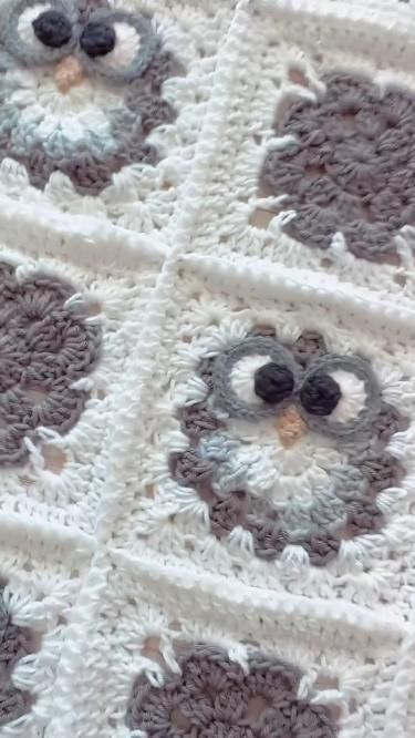 an owl crocheted blanket is shown on the floor