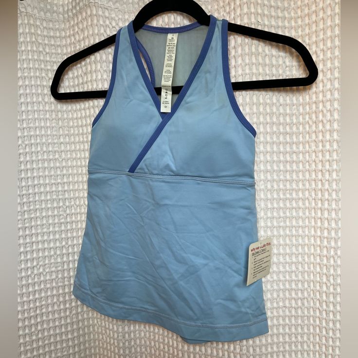 New With Tags, Light Blue Workout Tank With Built In Bra. Two Toned Blue. Size 4 Functional Blue Racerback Tops, Blue Sleeveless Go-dry Activewear, Sleeveless Blue Go-dry Activewear, Moisture-wicking Light Blue Workout Top, Blue Fitted Racerback Activewear, Blue Sleeveless Activewear For Light Exercise, Fitted Light Blue Activewear For Training, Blue Moisture-wicking Tops For Light Exercise, Blue Go-dry Racerback Top