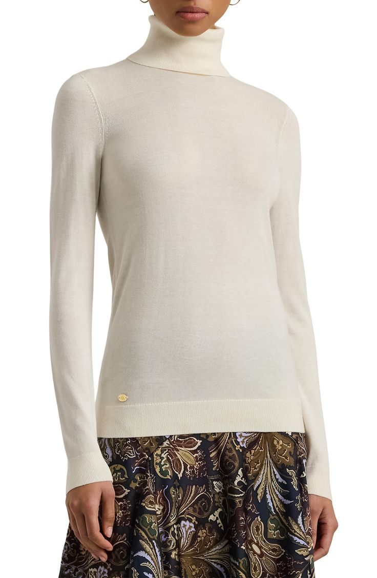 Silk-enriched yarns refine the fit and feel of this sweater knit with a slim, figure-skimming fit and finished with a tall turtleneck that keeps you warm as temperatures dip. Turtleneck Long sleeves with ribbed cuffs 42% modal, 33% silk, 25% recycled nylon Dry clean or machine wash, dry flat Imported Elegant Knit Top With Ribbed Collar For Work, Elegant Merino Wool Top With Textured Knit, Elegant Merino Wool Tops With Textured Knit, Elegant Textured Merino Wool Knit Top, Elegant Knit Sweater For Layering, Elegant Merino Wool Textured Knit Top, Elegant Knit Top With Funnel Neck, Elegant Textured Knit Sweater For Layering, Elegant Crew Neck Knit Top With Ribbed Cuffs