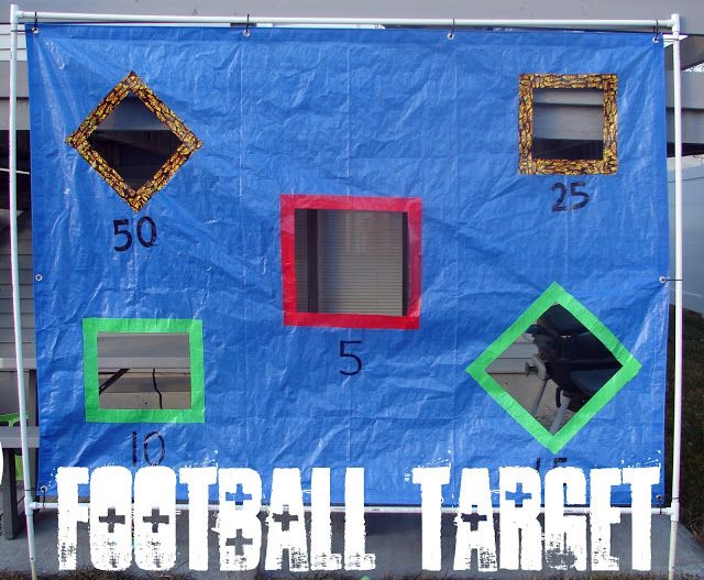 a blue tent with numbers and squares on it that says football tarp in white letters