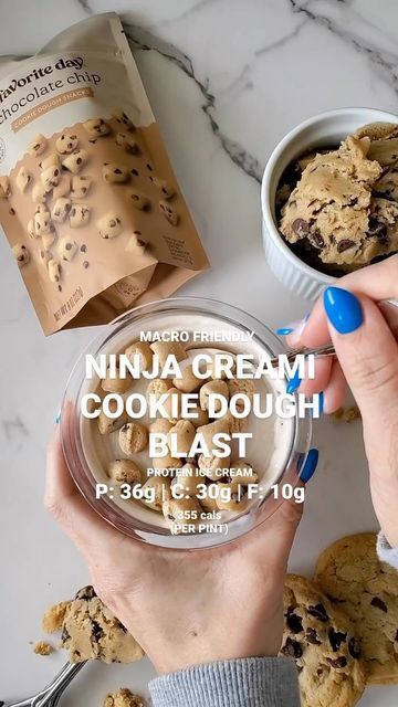 a person holding a bowl of cookie dough next to two bowls of cookies on a table