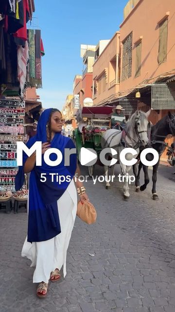 a woman walking down a street next to a horse and carriage with the words morocco 5 tips for your trip