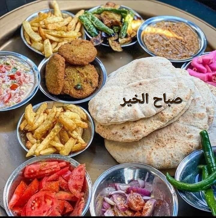 an assortment of food is displayed in bowls on a tray with the word arabic written above it