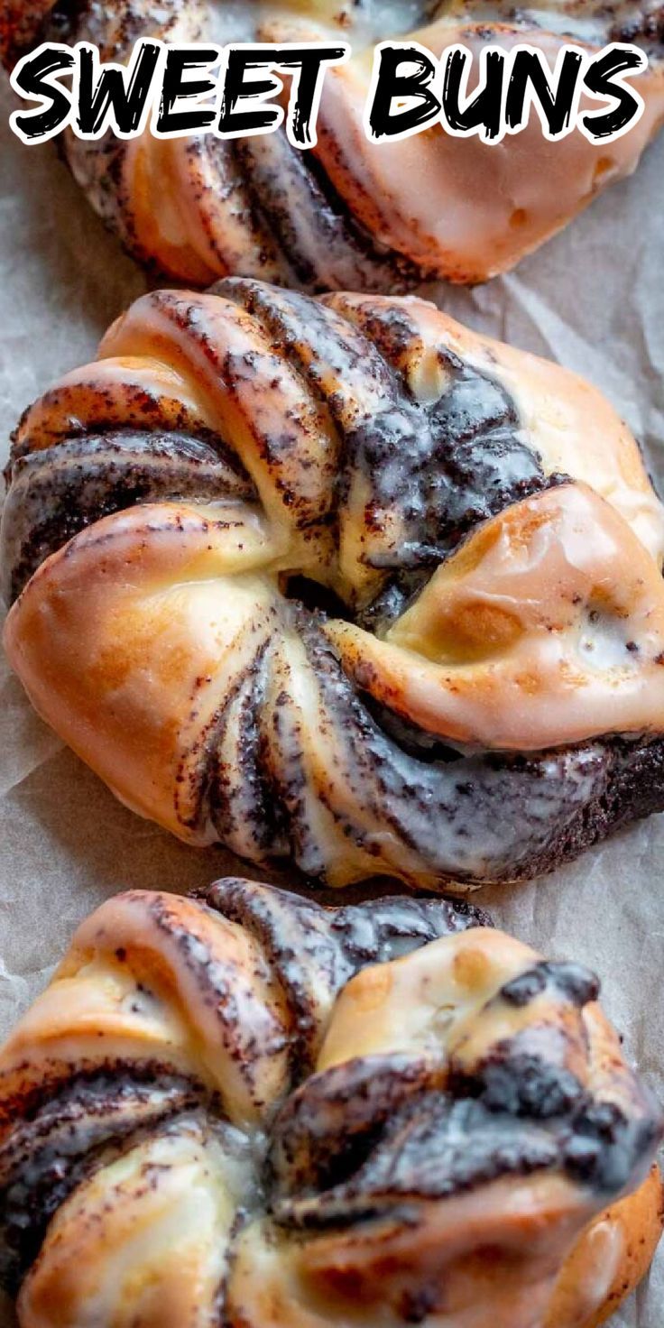 cinnamon buns with chocolate icing on top and the words sweet buns above them