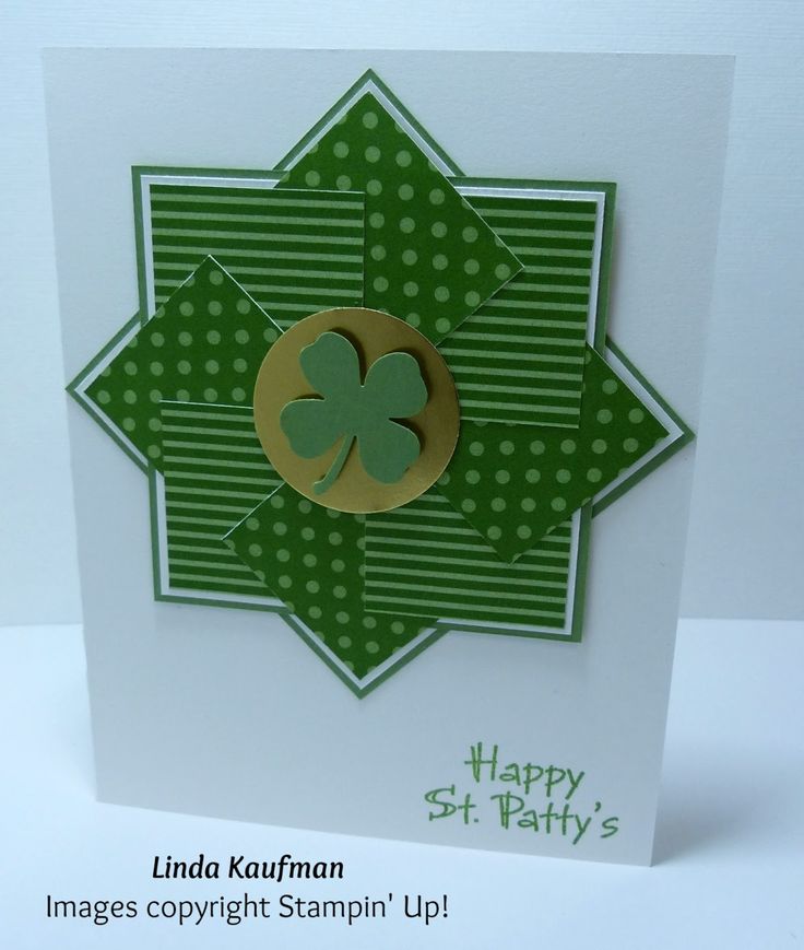 a green and white card with a shamrock on it