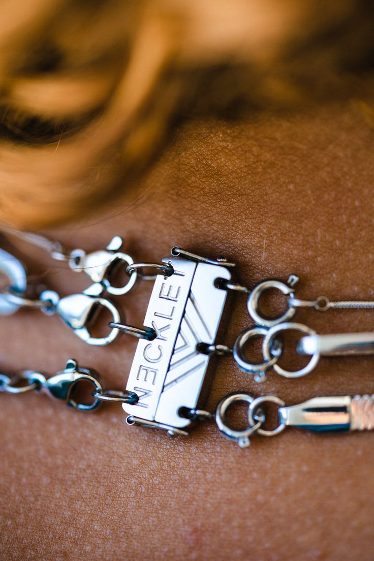 a close up of a woman's belt with scissors attached to the clasps