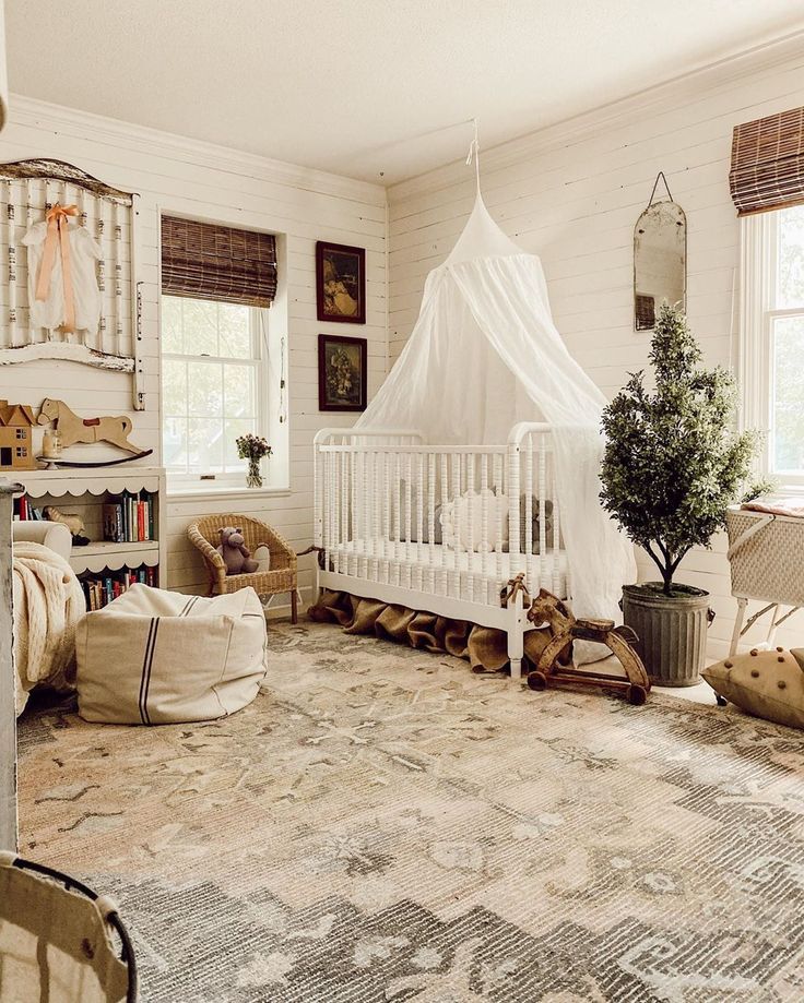 a baby's room with a white crib and lots of furniture