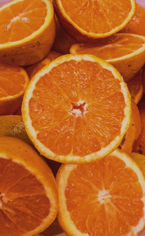 oranges cut in half sitting on top of each other