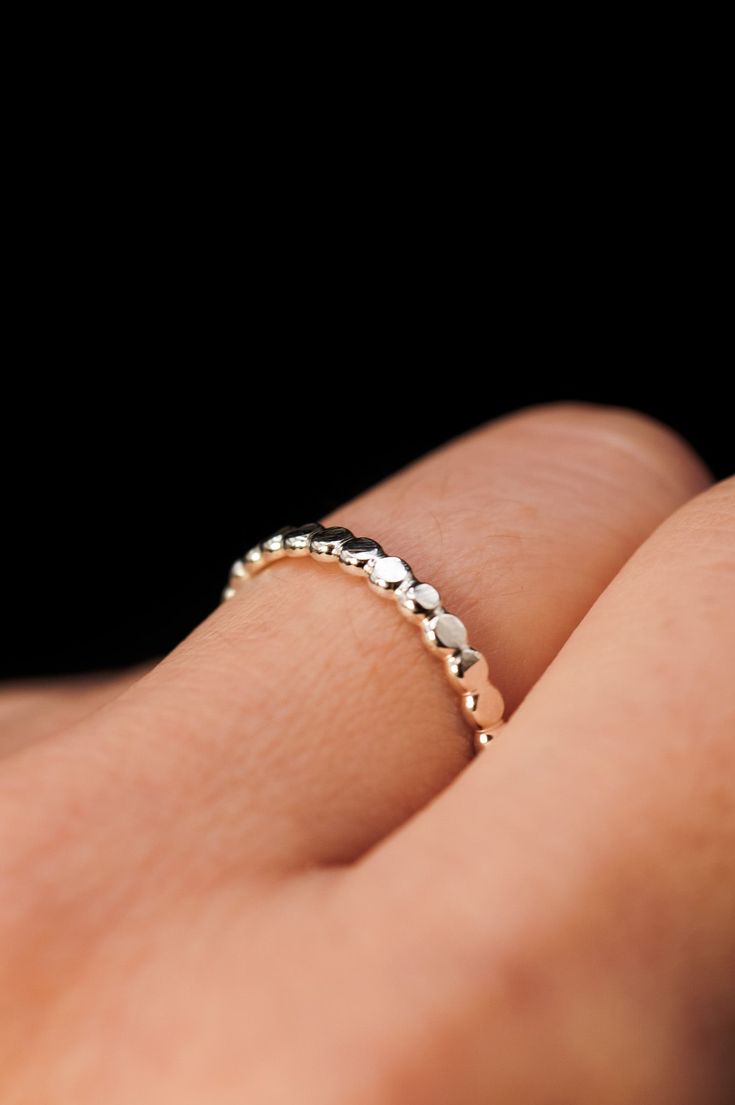 This stacking ring is perfect for mixing and matching! Either wear several at once or mix some in with your favorite rings for extra width and sparkle! This listing is for ONE SINGLE ring.This ring is made out of STERLING SILVER metal.The finish is lightly faceted/hammered.* The last photo shows this new Mini Bead Ring Flat Back Earrings, Single Ring, Bead Set, Gold Ring Stack, Sustainable Jewelry, Ring Style, Beaded Rings, Favorite Rings, Stacking Ring