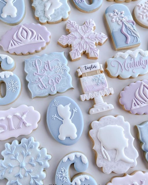 decorated cookies are displayed on a white surface