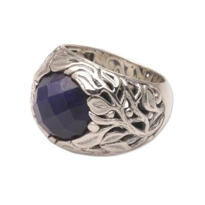 Add an elegant touch of nature to your look with this beautiful cocktail ring from Bali. Artisan Lenny designs the ring with five carats of sapphire that shimmers from a floral prong setting. Local artisans hand craft the accessory from sterling silver with the intricate vine details decorating the sides of the crown. Faceted Sapphire Ring In Fine Jewelry Style, Nature-inspired Sapphire Ring For Anniversary, Elegant Sapphire Faceted Rings, Faceted Sapphire Ring Jewelry, Elegant Faceted Sapphire Promise Ring, Elegant Sapphire Rings With Faceted Detail, Elegant Sapphire Rings With Faceted Cut, Elegant Faceted Sapphire Ring, Elegant Faceted Sapphire Ring For Anniversary