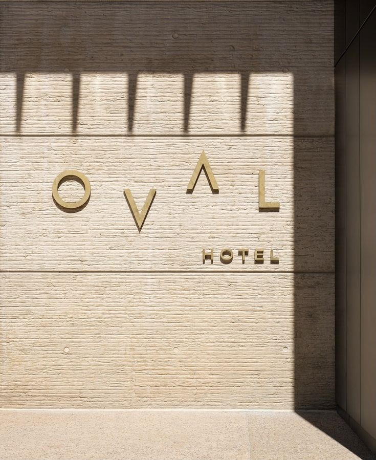 the word ovel is carved into the side of a building