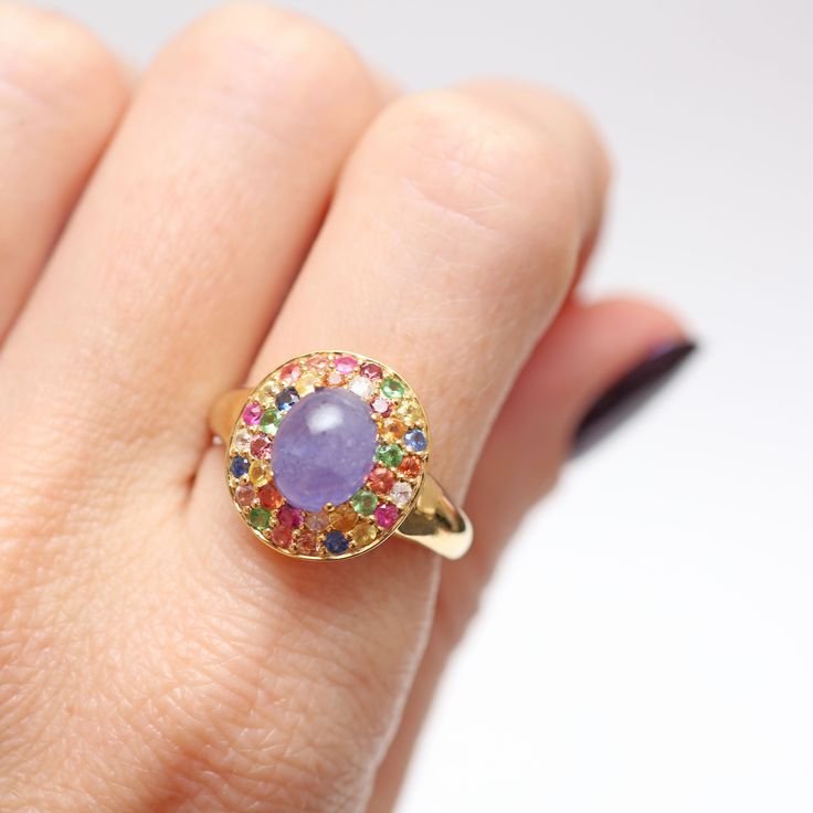 Adding some really fun affordable items to the shop for a quick pick-me-up or holiday present. This piece is super colorful with a lovely purple hazy tanzanite cabochon surrounded by a rainbow of tourmalines. Ring face measures approx. 15m x 14mm. Ring size 7.25. Setting is gold vermeil (gold over sterling silver). Watch Cufflinks, Tanzanite Ring, A Rainbow, Card Sizes, Earring Necklace, Gold Vermeil, Ring Shopping, Tourmaline, Ring Earrings