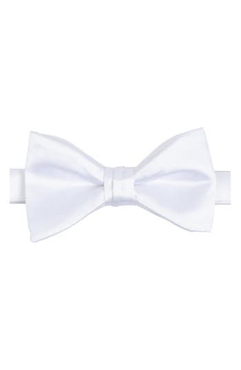 Bring versatility and distinction to any formal look with this pre-tied bow tie crafted in a solid color from smooth and silky satin. 2 1/4" width 22" length Pre-tied; adjustable 100% polyester Dry clean Imported Pre-tied Satin Bow For Black Tie Events, Classic White Bow For Formal Occasions, Classic White Tie With Bow Tie Back, Classic White Bow Tie With Detachable Bow, Classic White Bow Tie For Formal Occasions, Formal White Bow Tie With Detachable Bow, Standard Tie Satin Bow, White Classic Bow Tie, Classic White Standard Tie Bow