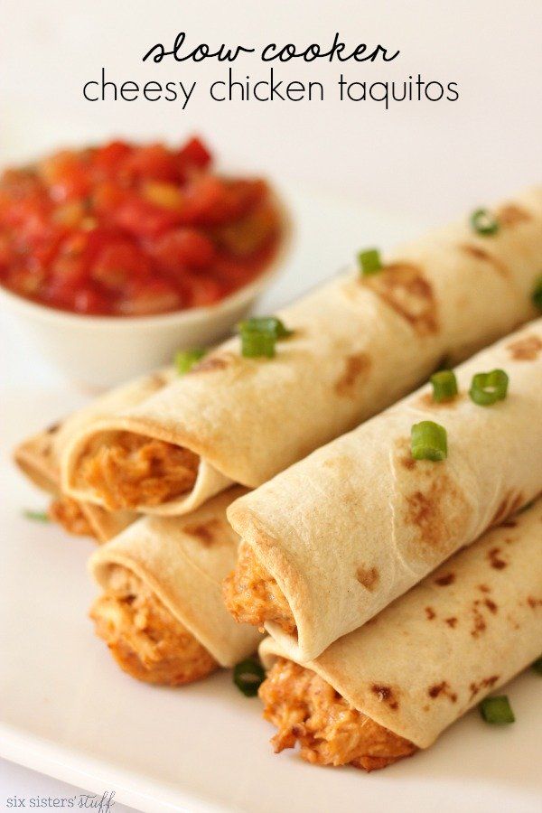 three chicken taquitass on a plate with salsa