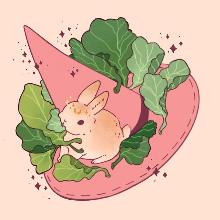 a mouse sitting on top of some leafy greens in the shape of a heart