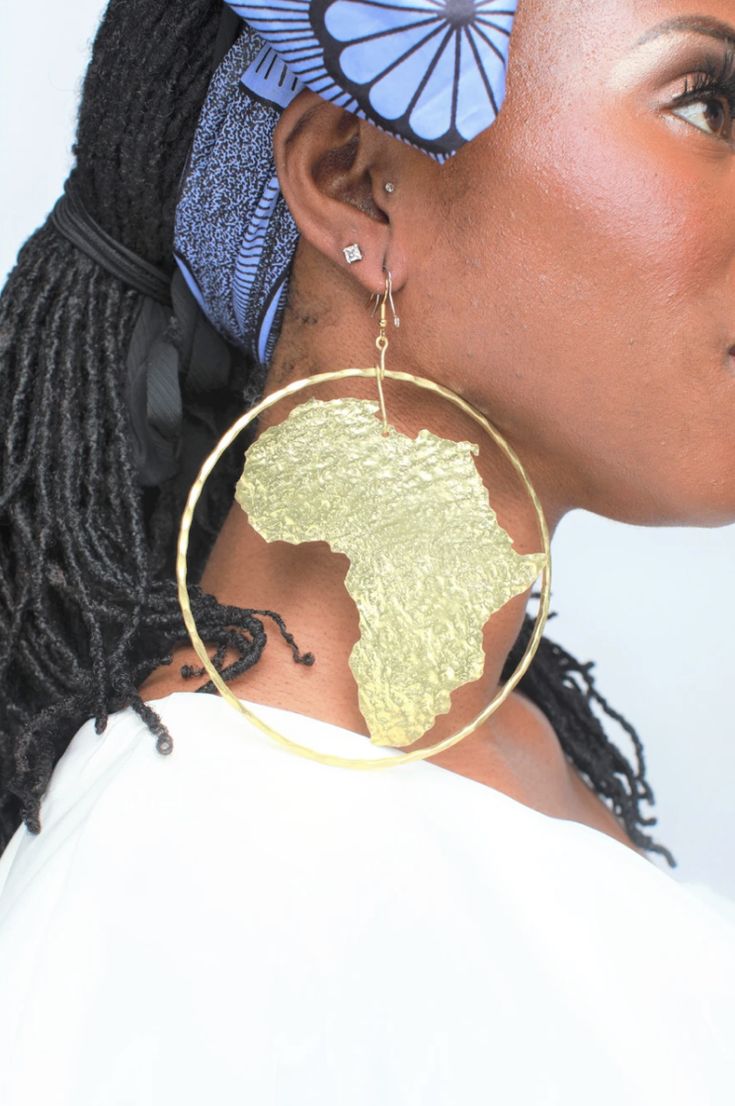 Handmade and handcrafted with love! Meet Morowa Tribal Africa Earrings. Morowa means Queen in the African language. She is carved from gold brass and though she looks heavy, she is actually lightweight! What do we think? 💜 Traditional Fair Trade Gold Jewelry, Traditional Brass Hammered Earrings, Traditional Adjustable Brass Hoop Earrings, Gold Colored Copper Earrings For Festivals, Gold Copper Festival Earrings, Gold Copper Earrings For Festival, Gold Copper Plug Earrings As Gift, Gold Copper Plug Earrings For Gift, Gold Hoop Earrings With Pierced Copper