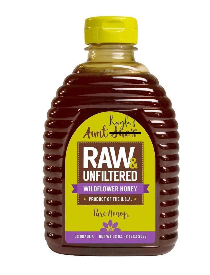 a bottle of raw and unfiltered wildflower honey on a white background