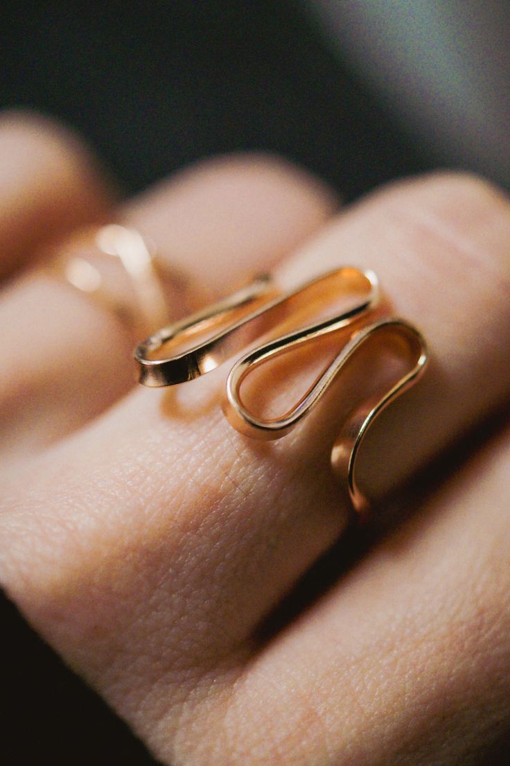 The elegant curves of this design are wave-like, creating a sense of movement and fluidity that is versatile and organic. The ring is handcrafted out of a D-shaped (half round) wire that is then flattened and formed into this three dimensional form. This listing is for ONE single ring in 14K Rose Gold Fill The thickness of the metal used with this ring measures approximately 2mm which gives this piece a durable and sturdy design while maintaining that effortless look. While this ring is gorgeous Modern Twist Spiral Jewelry In 14k Gold, Elegant Spiral Bypass Ring, Minimalist 14k Gold Spiral Jewelry, Minimalist Curved Gold Jewelry, Elegant 14k Gold Wire Wrapped Rings, Elegant 14k Gold Spiral Rings, Yellow Gold Minimalist Jewelry, Minimalist Yellow Gold Curved Jewelry, Minimalist Curved Yellow Gold Jewelry