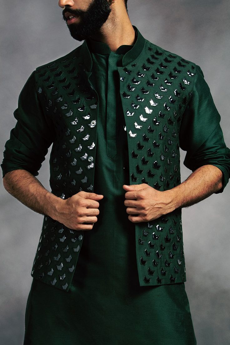 Green bundi with applique embroidered motifs. Comes with kurta and pant.
Components: 3
Fabric: Cotton Silk
Neckline: Kurta: Band collar; Bundi: Band collar
Sleeve Length: Kurta: Full; Bundi: Sleeveless
Color: Green
Embroidery - Aza Fashions Kurta Set Men, Kurta Set For Men, Embroidered Motifs, Green Embroidery, Silk Kurta, Nehru Jackets, Band Collar, Kurta Set, Embroidered Silk