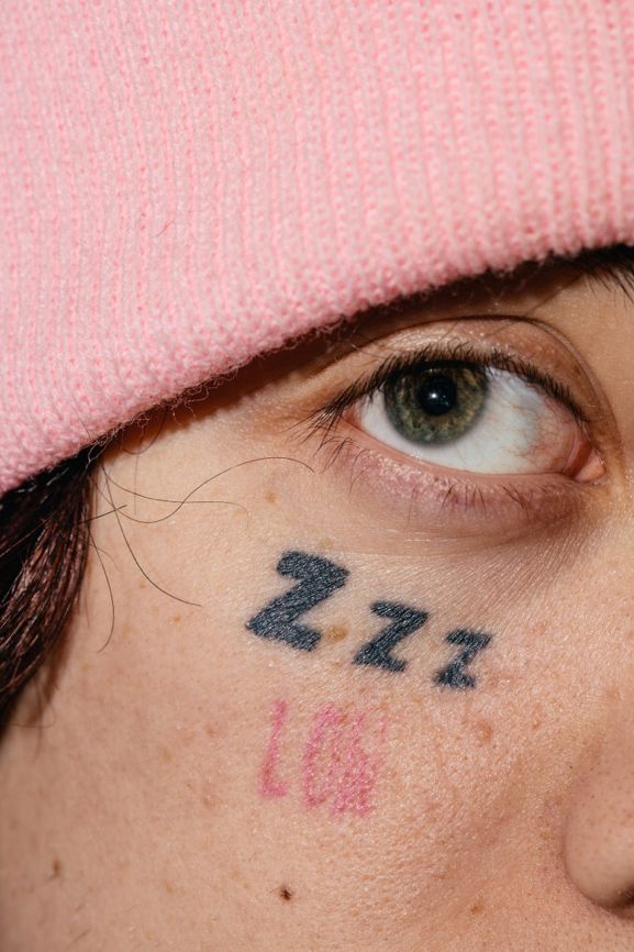 a close up of a person's eye with the word love written on it