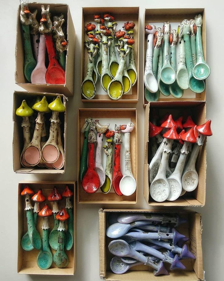 several boxes filled with different kinds of spoons