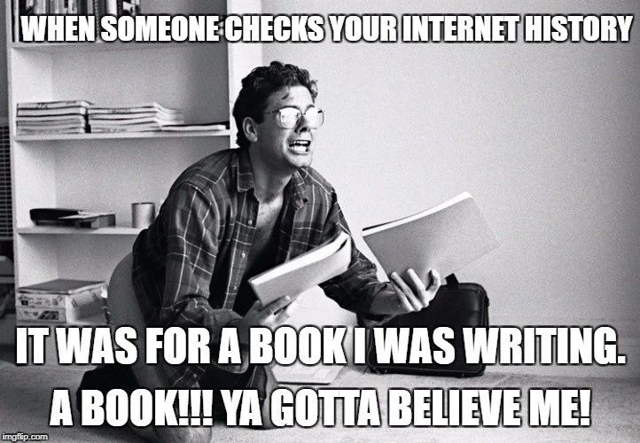 a man is sitting on the floor reading a book and laughing at someone elses your internet history it was for a book i was writing