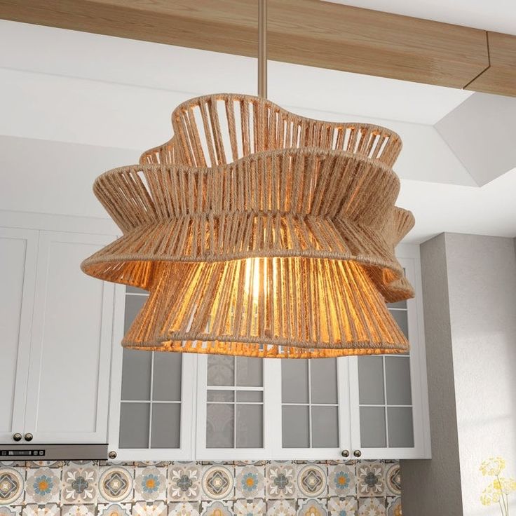 a bamboo light fixture hanging from the ceiling in a kitchen with tile backsplash