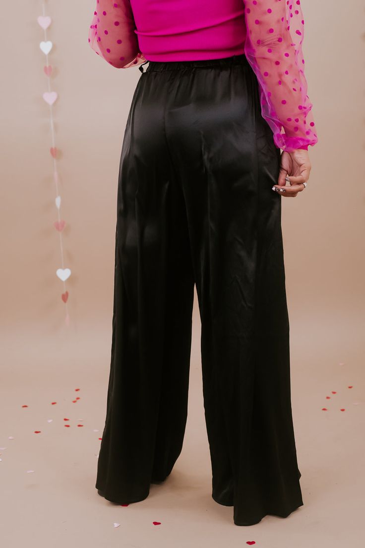 Simply sleek, this satin wide leg style pant is featured in a true to size fit with a removable adjustable tie belt. We love the elegance that this pant generates. Waistband: High rise Fabric: 95% Polyester, 5% Spandex Details: Sleek satin fabrication, adjustable tie belt waistband, wide leg bottom Imported Fit: True to size!- Waist: Elastic/High rise- Leg: Wide leg - Stretch only in waistband InseamSmall: 29 Inches Medium: 29 1/2 inches Large: 29 3/4 Inches Model Specs: Karli are wearing a size Fluffy Pants, Saree Skirt, Satin Pant, Skirt Satin, Silk Clothes, Style Pant, Sequin Outfit, Satin Pants, Vip Group