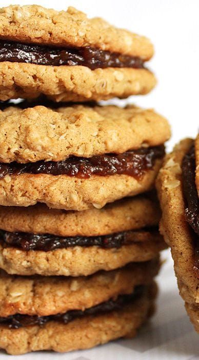 a stack of cookies with jam on top