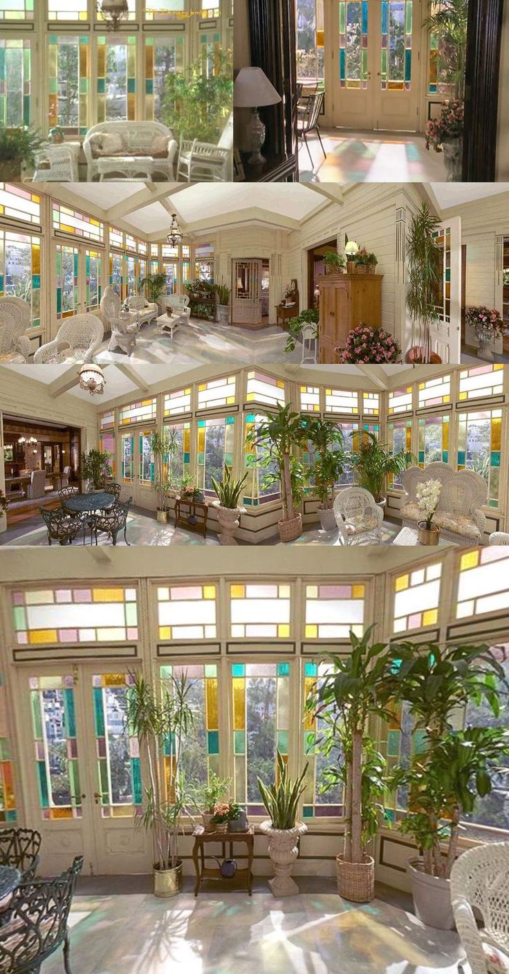 the inside of a large house with lots of windows and plants in it's center