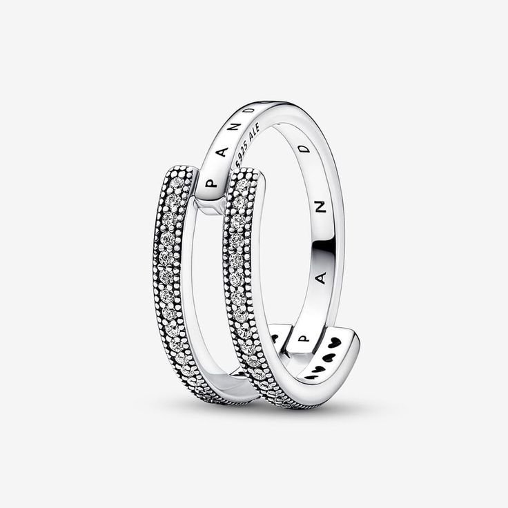 Take your signature stack to the next level with the Pandora Signature Logo & Pavé Double Band Ring. The unique shape of this sterling silver ring makes it a stand-out piece; one half features two parallel bands with rows of sparkle framed by microbeading, the second half is a single band that connects the double shape, creating a sculptural contrast. Perfect on its own or layered, it's the jewelry collection essential you'll reach for over and over. Pandora Signature Logo & Pavé Double Band Rin Pandora Logo, Double Band Ring, Double Band Rings, Pandora Rings, One Half, Jewelry Essentials, Thomas Sabo, Ring Size Guide, Signature Logo